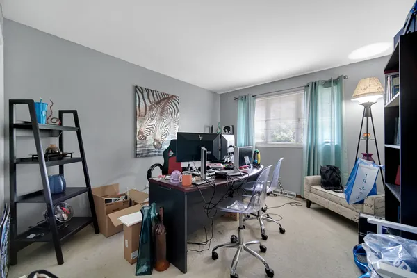 a work room with furniture and windows