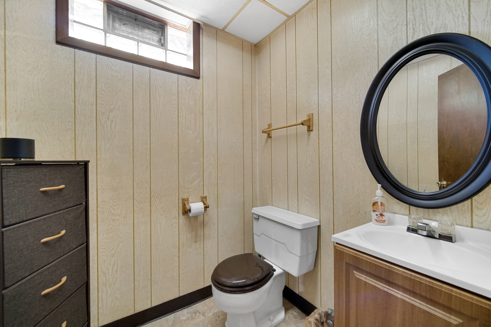18443 Maple Street Lansing, IL 60438 - Photo 14 of 20 a bathroom with a sink a toilet and a mirror