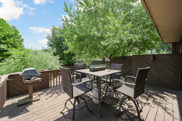 a patio with table and chairs