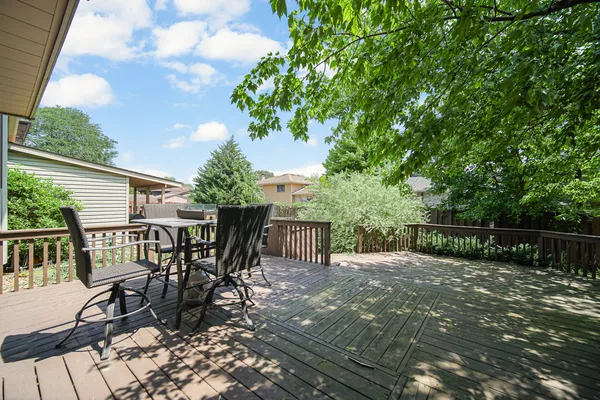 a view of a chairs and table in patio
