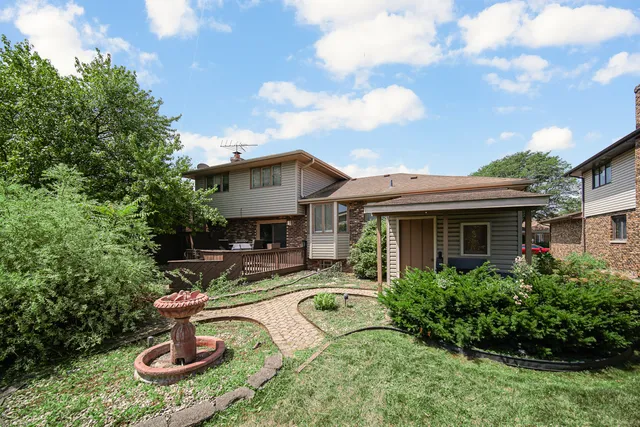 a house view with a garden space