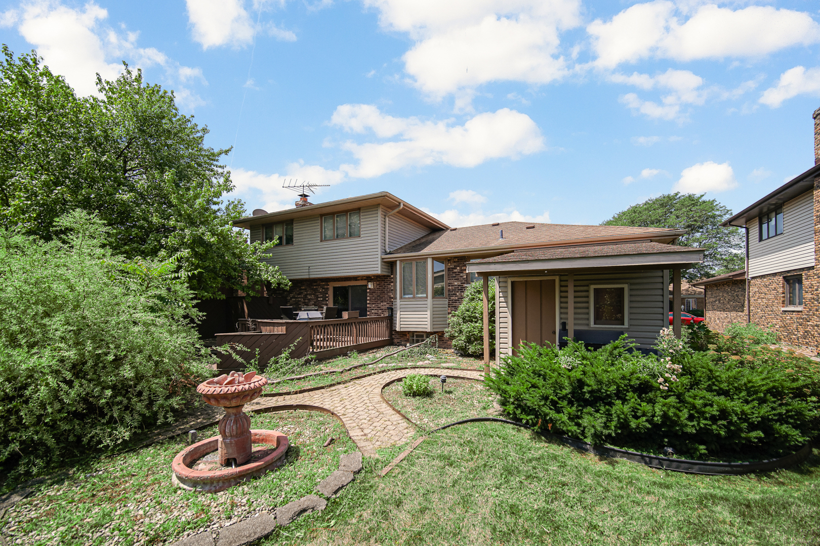 18443 Maple Street Lansing, IL 60438 - Photo 19 of 20 a house view with a garden space