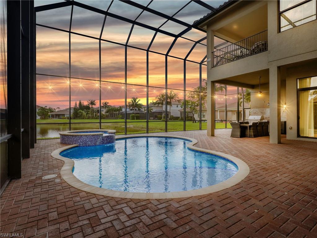 2756 Crystal Way Naples, FL 34119 - Photo 41 of 50 a view of a swimming pool with a lounge chairs
