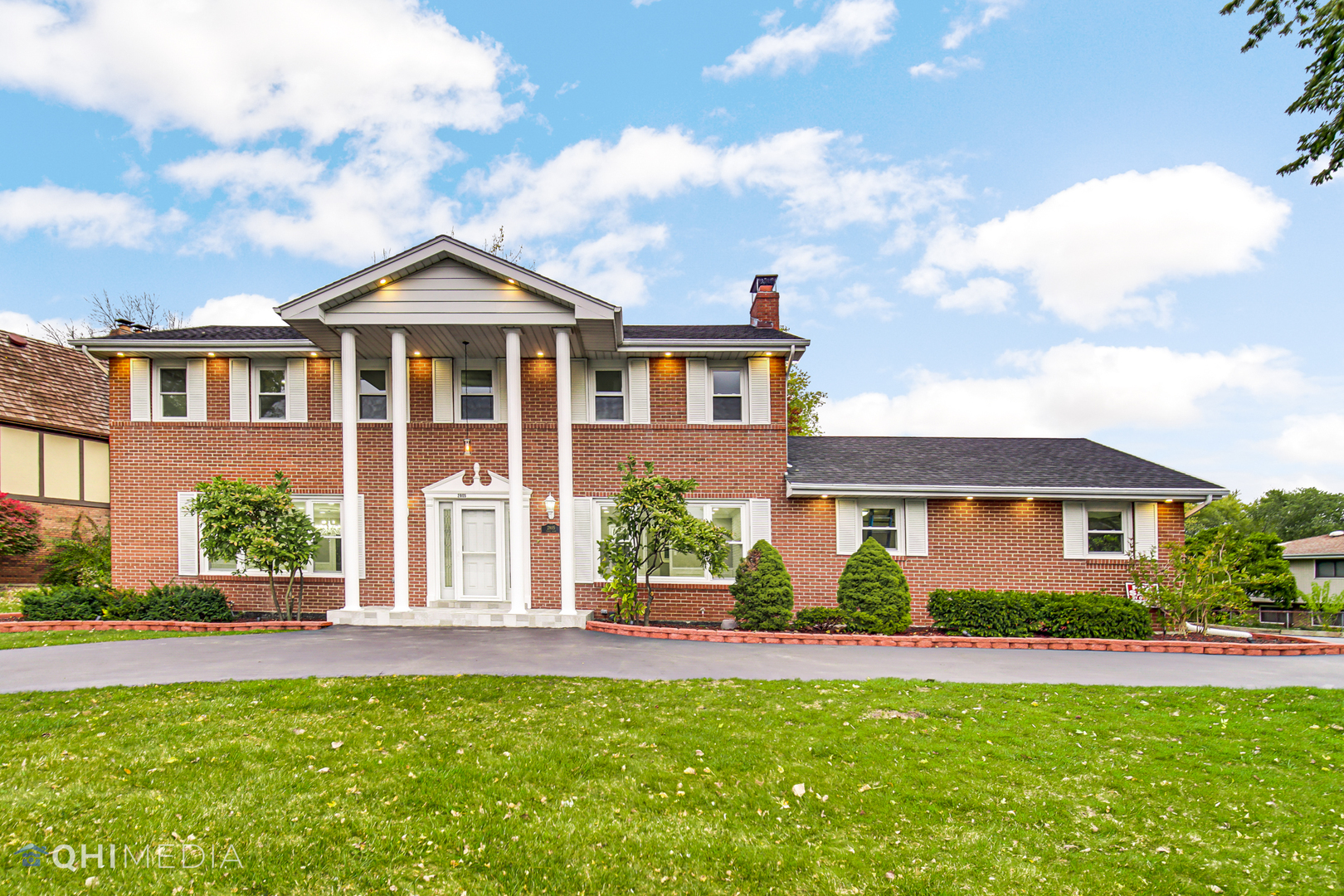 a front view of a house with a yard