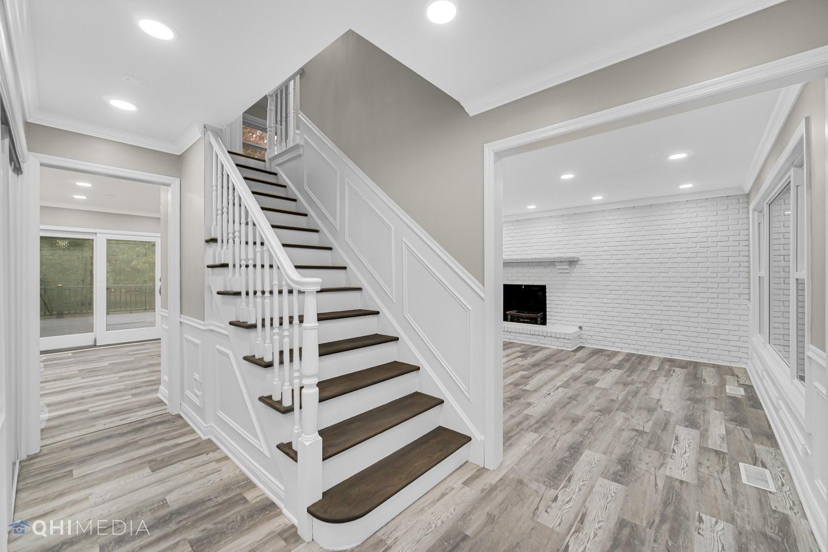 Undisclosed Address Olympia Fields, IL 60461 - Photo 12 of 38 a view of a hallway with stairs and wooden floor