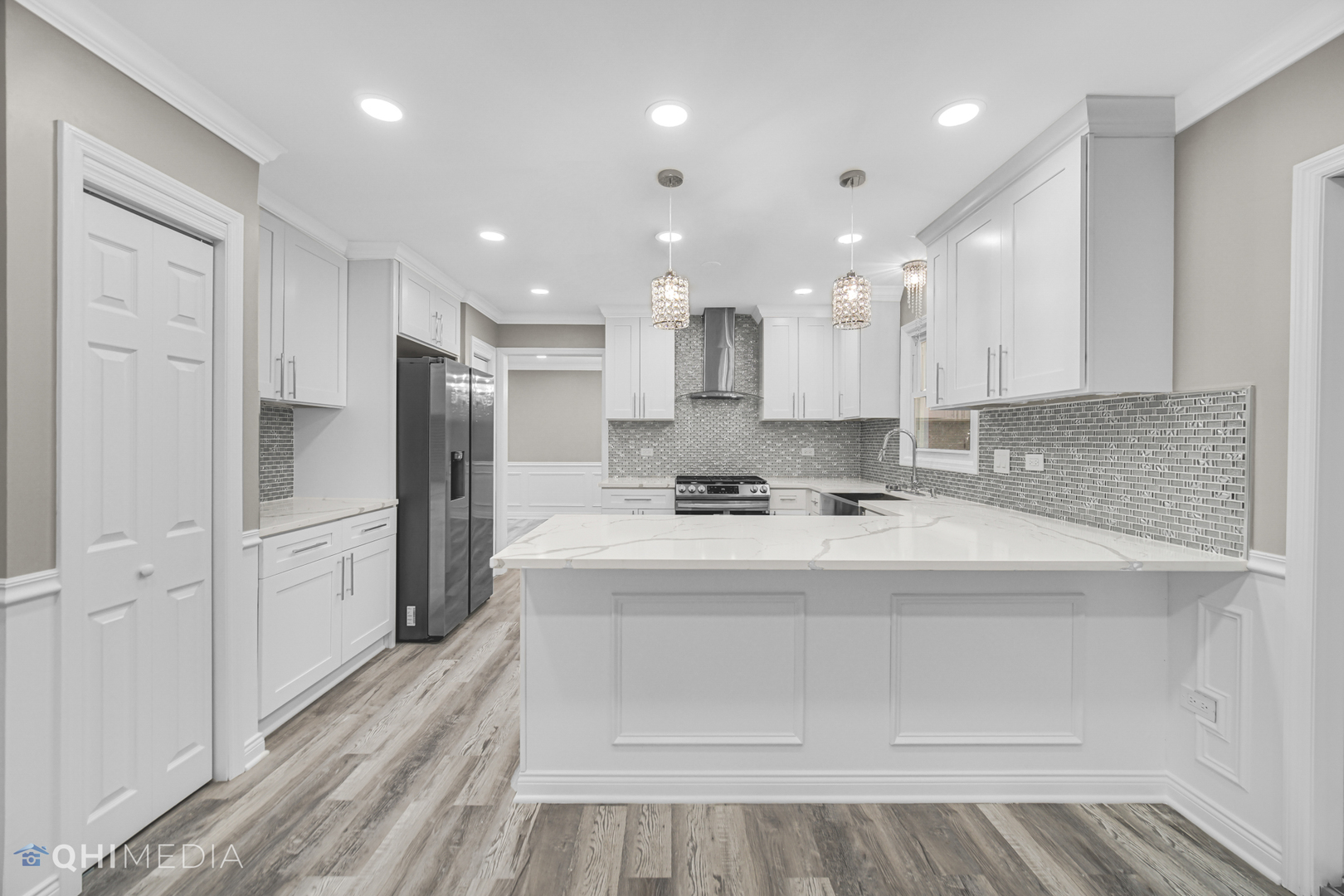 Undisclosed Address Olympia Fields, IL 60461 - Photo 18 of 38 a large white kitchen with a refrigerator a sink and a stove