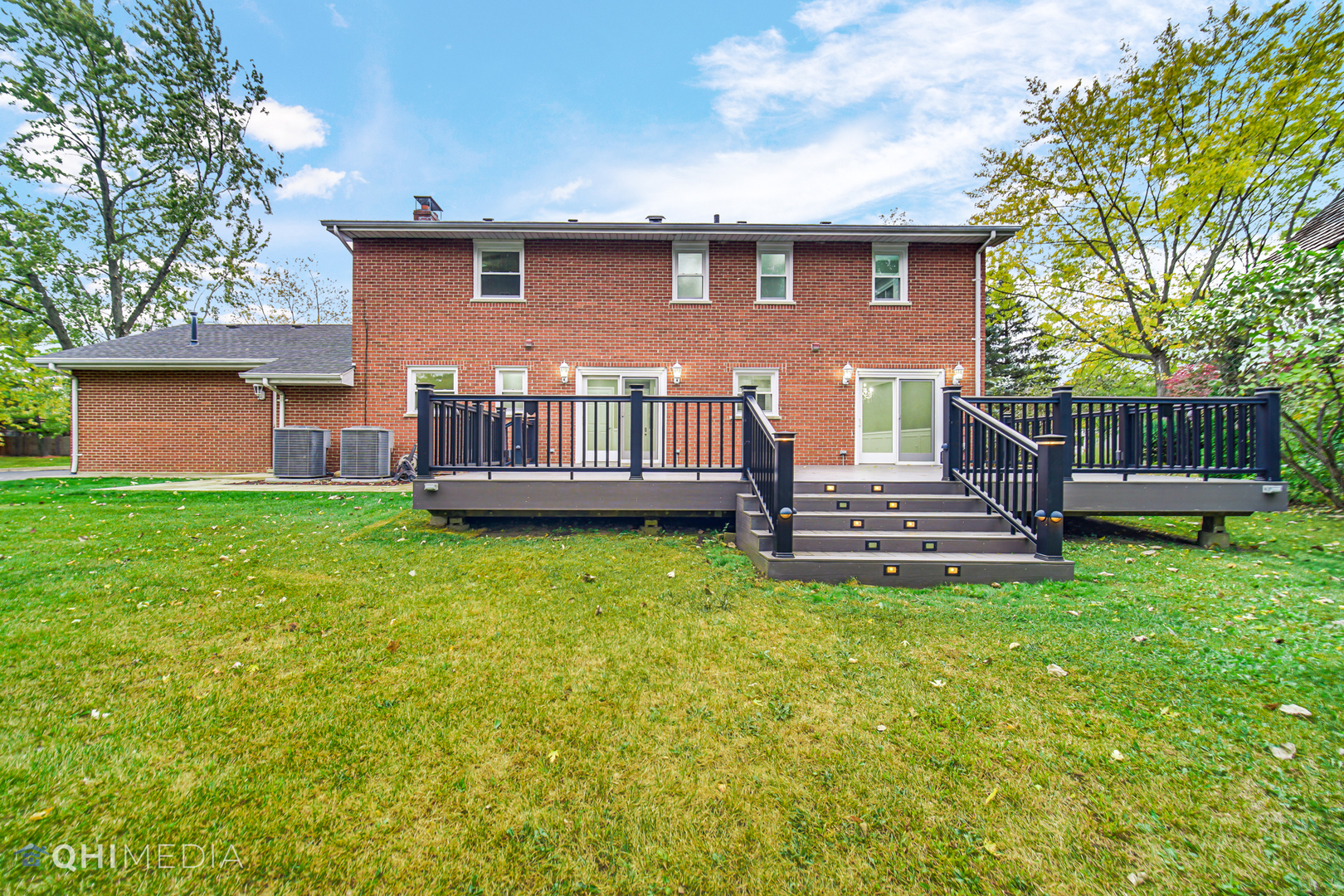 Undisclosed Address Olympia Fields, IL 60461 - Photo 37 of 38 a front view of a house with a garden and deck