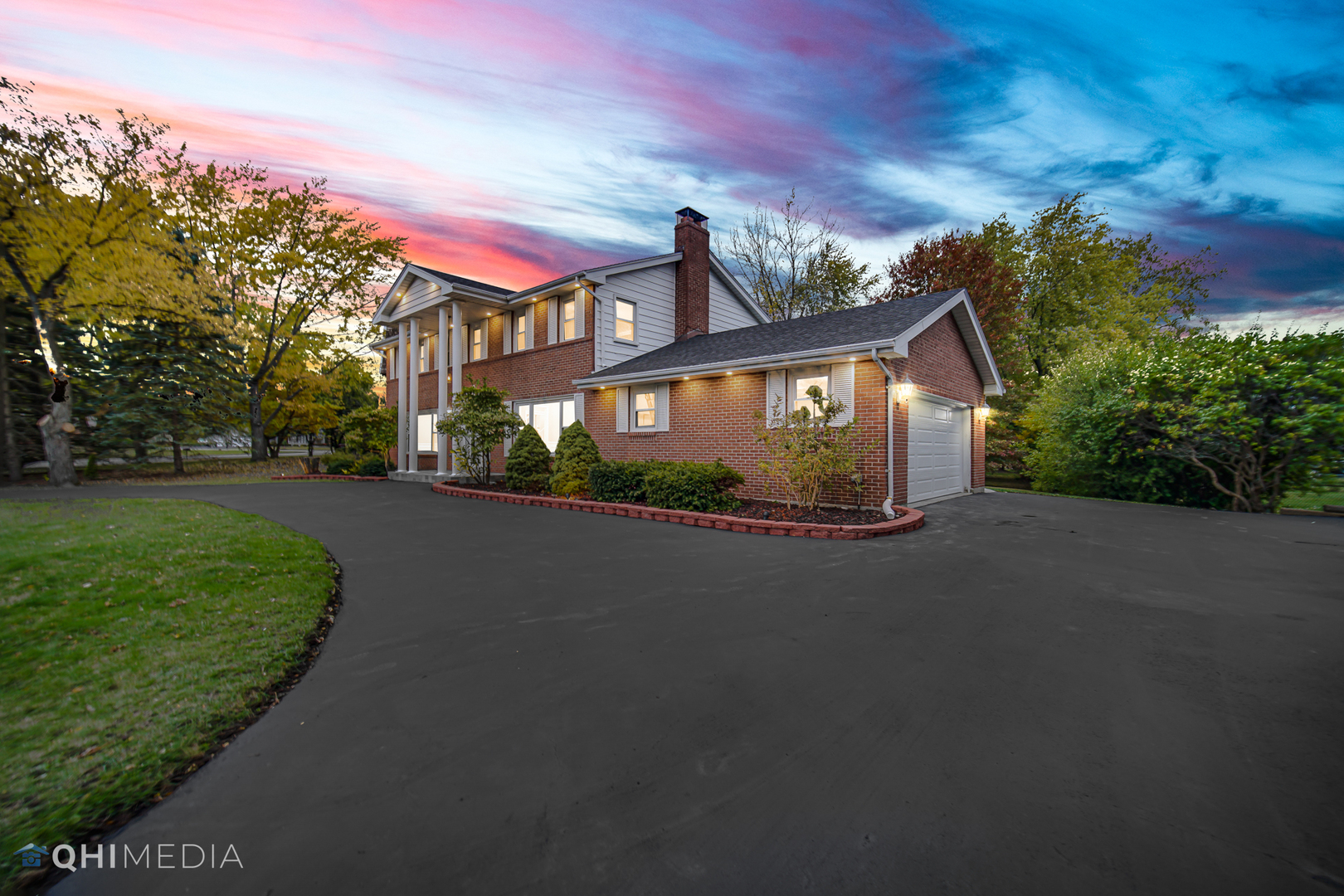 Undisclosed Address Olympia Fields, IL 60461 - Photo 5 of 38 a front view of a house with a yard and garage
