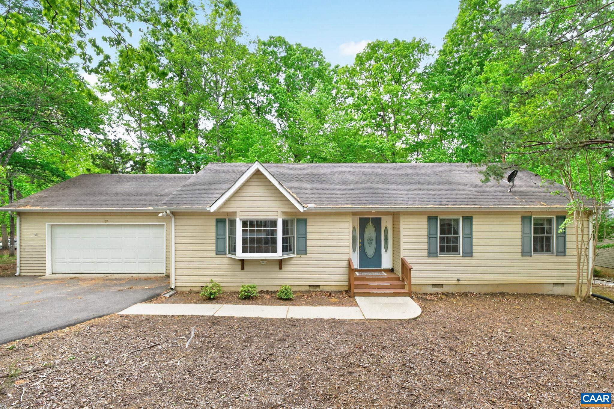 front view of a house with a yard