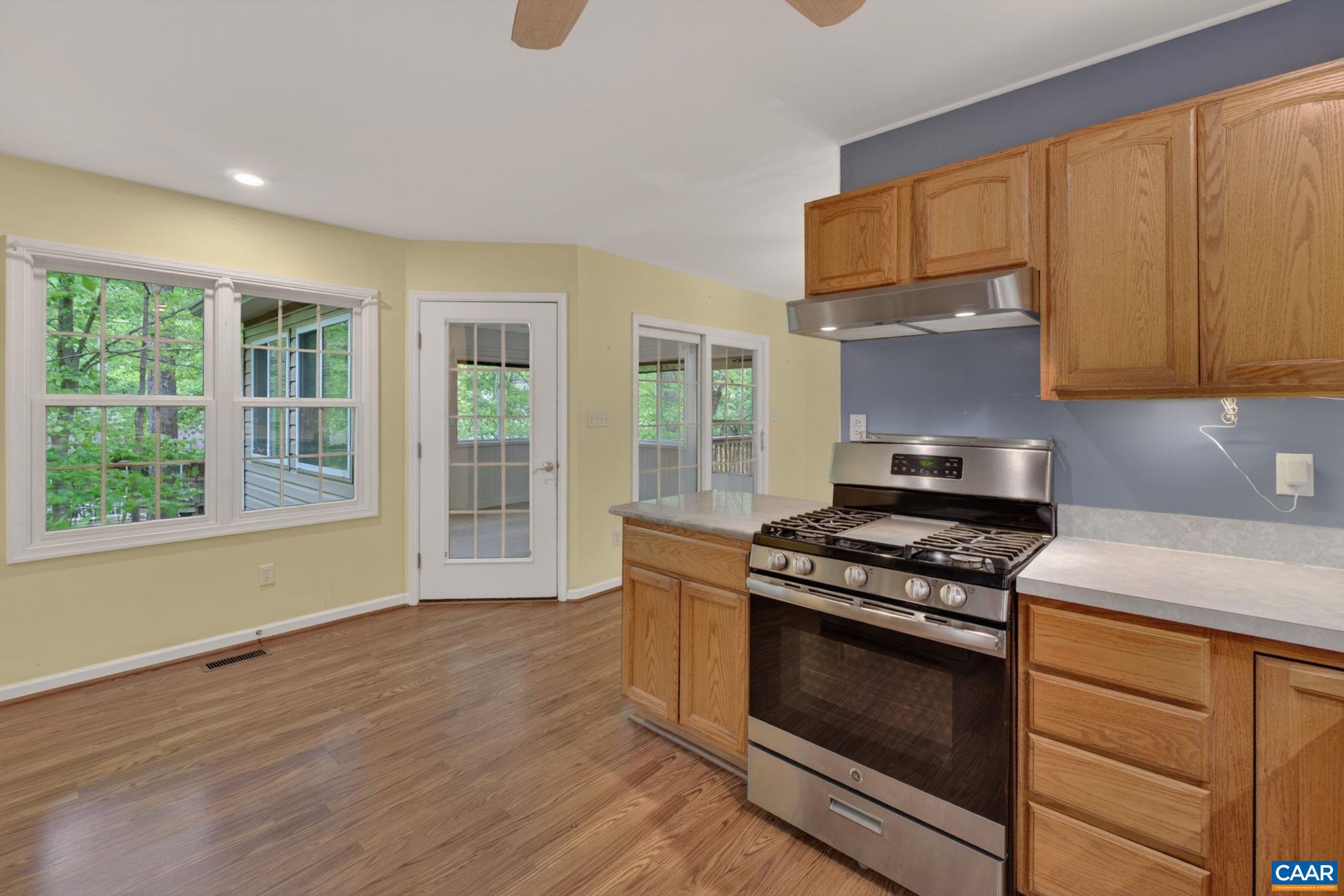 37 Laguna Road Palmyra, VA 22963 - Photo 18 of 44 a kitchen with granite countertop wooden floors and stainless steel appliances