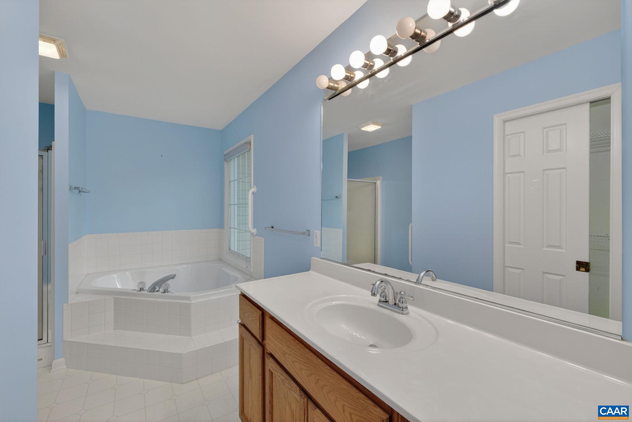 37 Laguna Road Palmyra, VA 22963 - Photo 29 of 44 a bathroom with a sink and a mirror