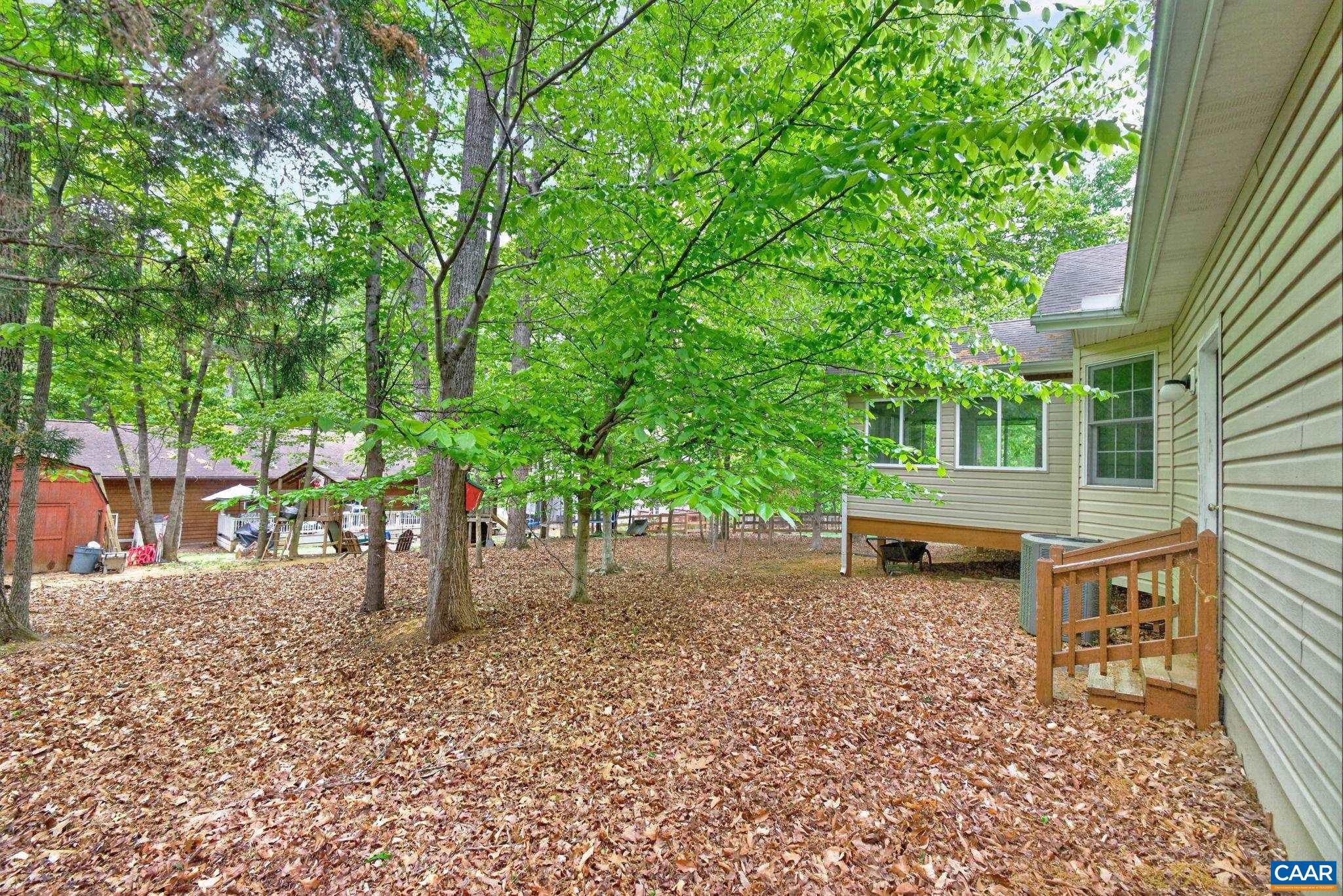 37 Laguna Road Palmyra, VA 22963 - Photo 42 of 44 a view of a backyard with a garden