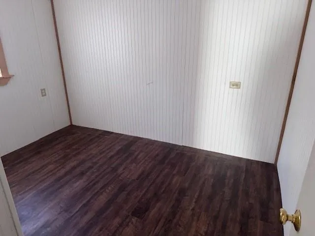 a view of a small space with wooden floor