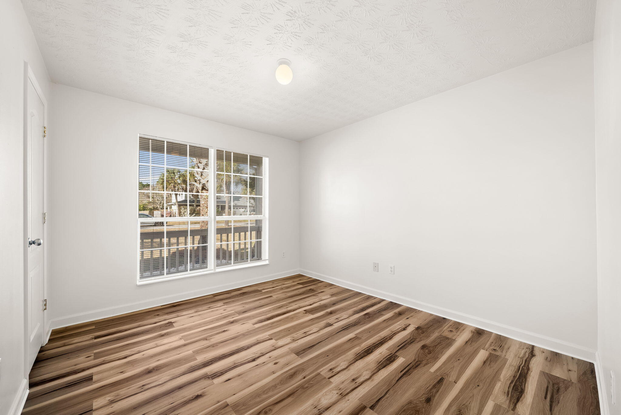 88 Tropical Way Freeport, FL 32439 - Photo 18 of 31 a view of a room with wooden floor and windows