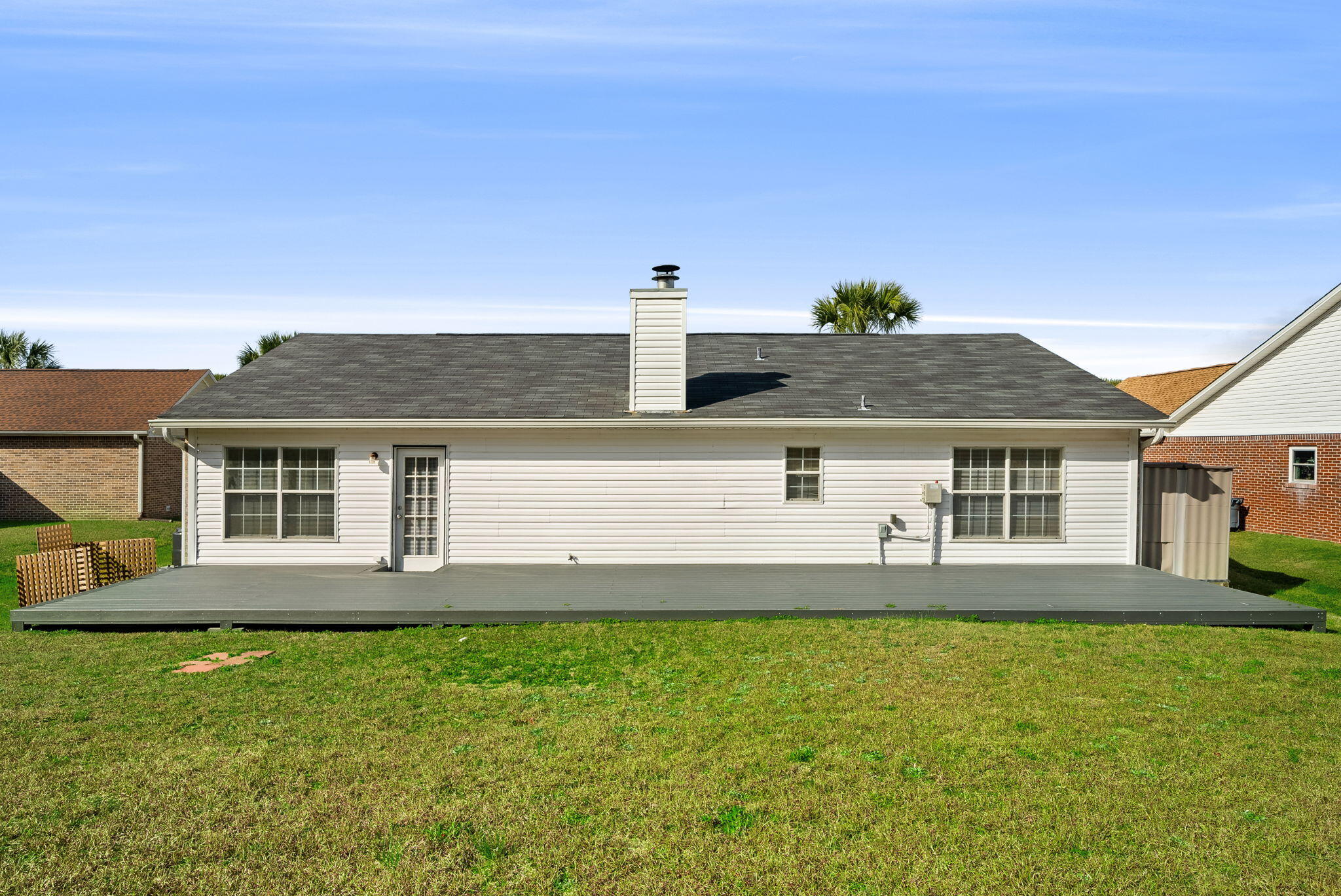 88 Tropical Way Freeport, FL 32439 - Photo 22 of 31 a front view of a house with a yard and garage