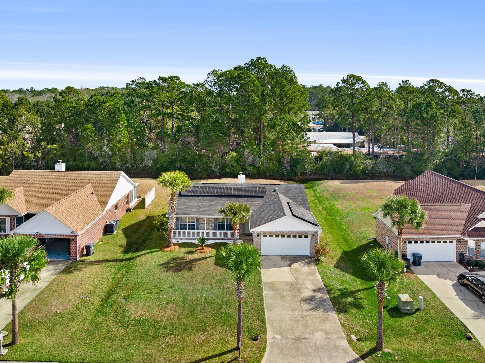 88 Tropical Way Freeport, FL 32439 - Photo 24 of 31 an aerial view of a house with garden space and street view