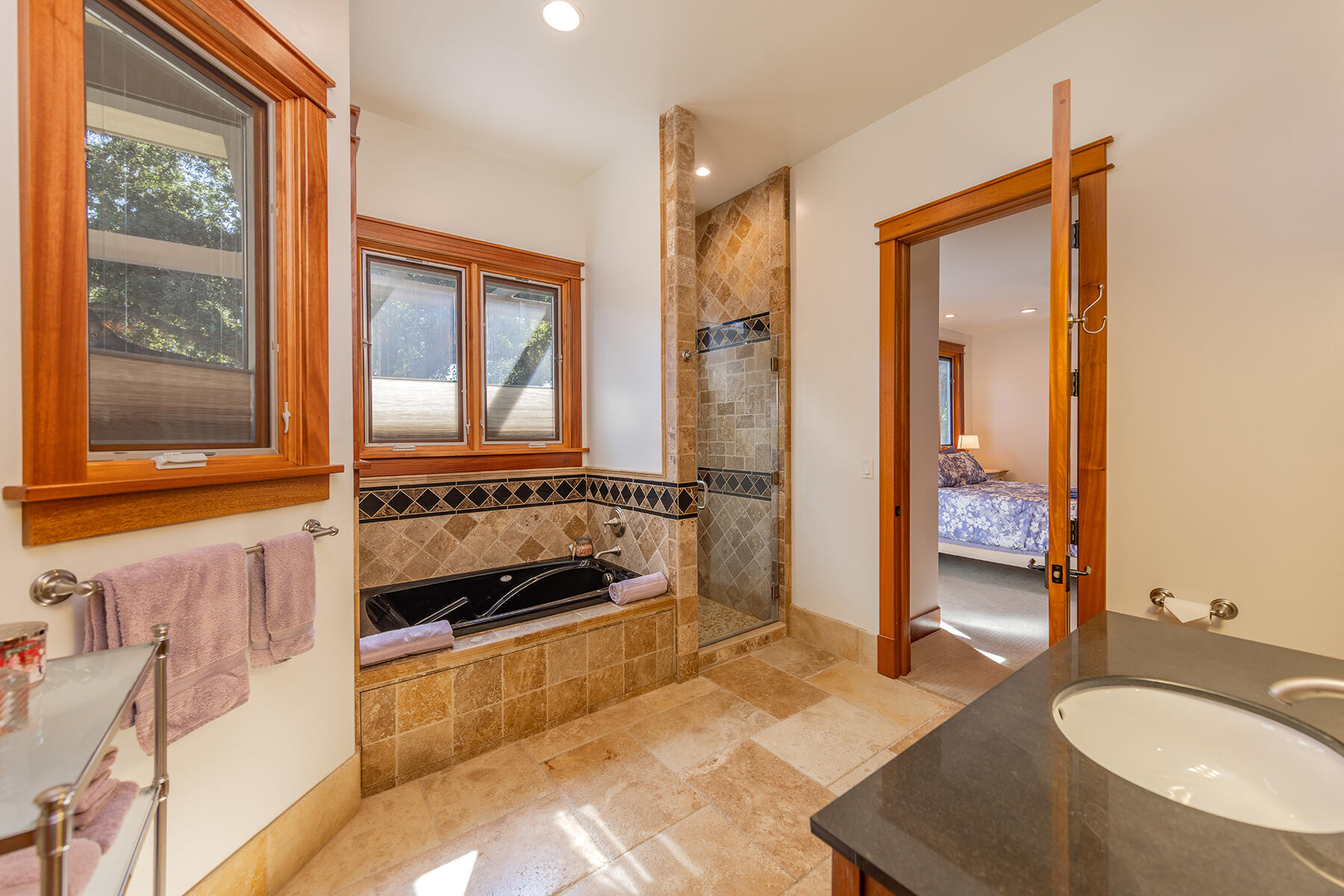 705 South Rice Road Ojai, CA 93023 - Photo 25 of 61 a bathroom with a tub a sink and a large mirror