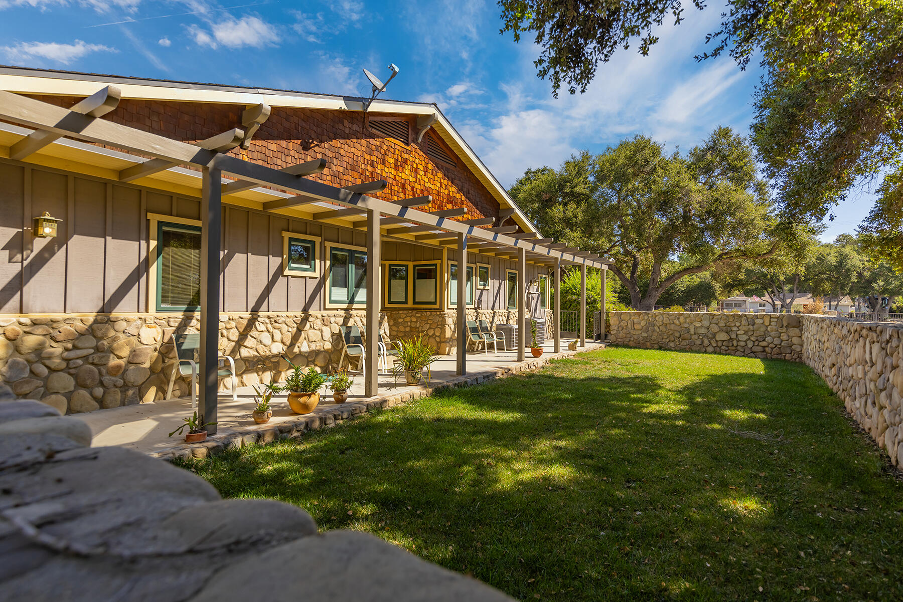 705 South Rice Road Ojai, CA 93023 - Photo 29 of 61 a view of a house with a yard