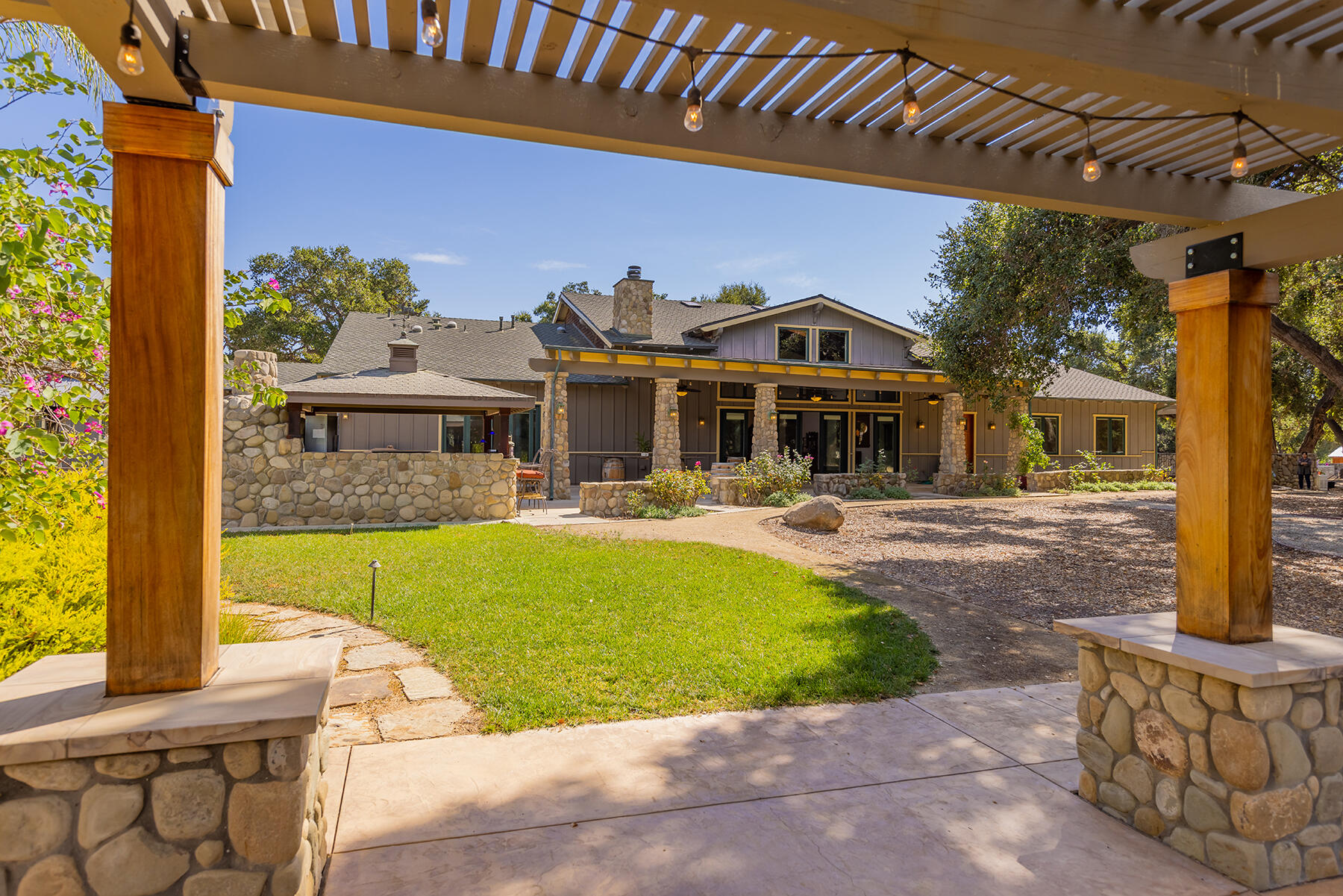 705 South Rice Road Ojai, CA 93023 - Photo 3 of 61 a front view of a house with a yard balcony