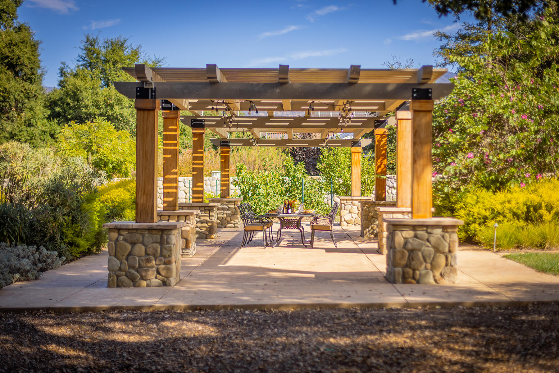 705 South Rice Road Ojai, CA 93023 - Photo 36 of 61 a view of a patio with table and chairs and potted plants