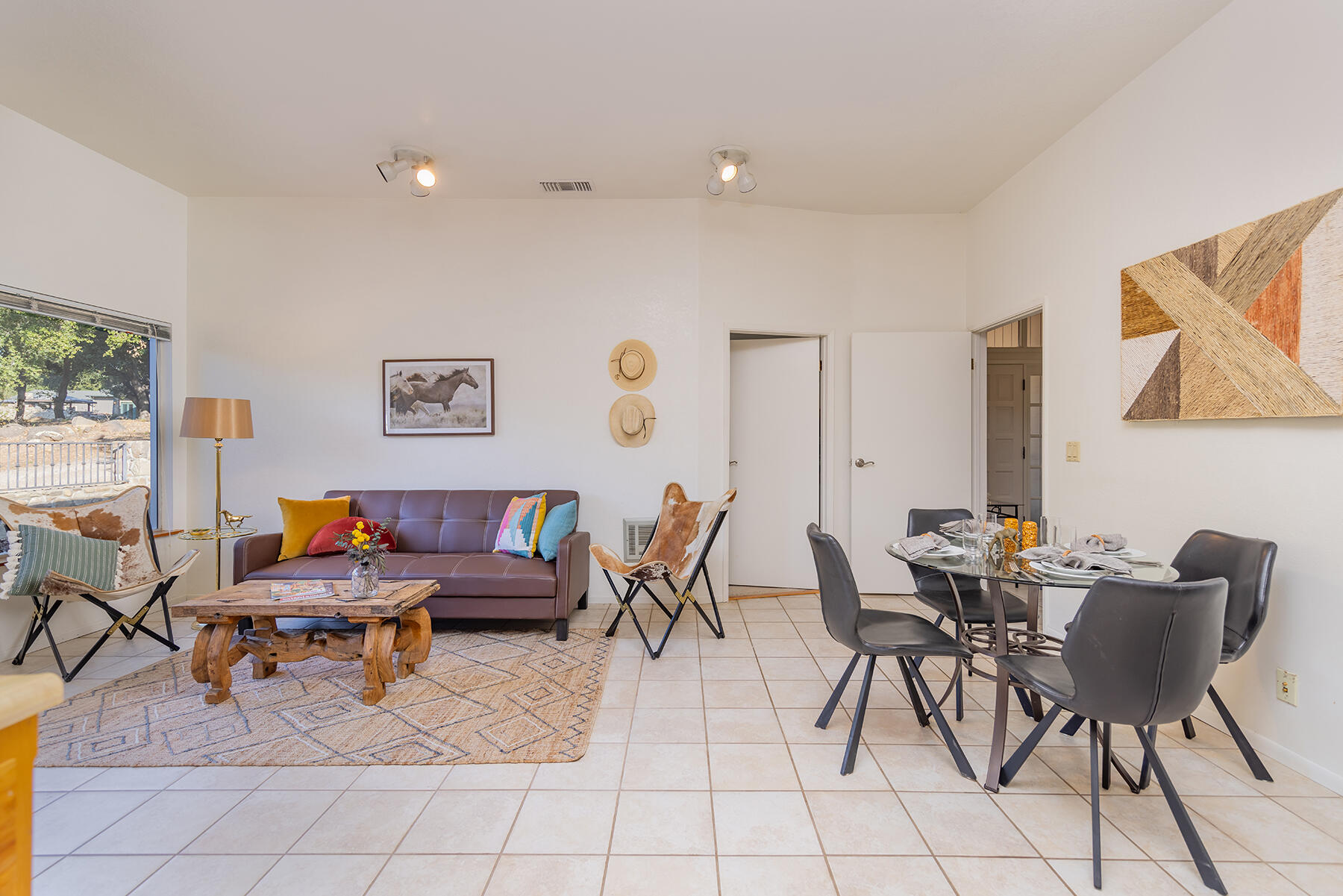 705 South Rice Road Ojai, CA 93023 - Photo 48 of 61 a living room with furniture and a painting on the wall