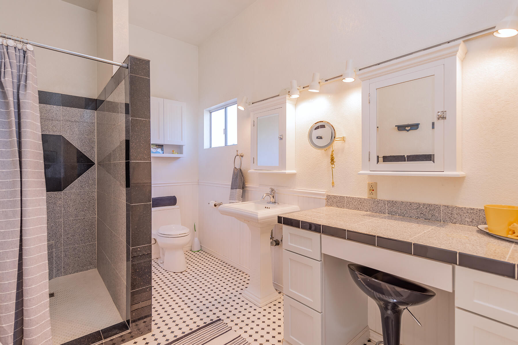 705 South Rice Road Ojai, CA 93023 - Photo 49 of 61 a spacious bathroom with a sink a toilet a mirror and shower
