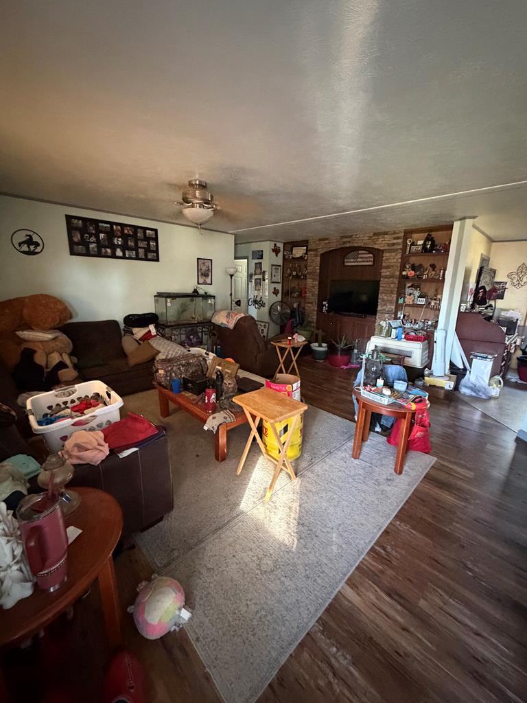 88 Wendel Road Harper, TX 78631 - Photo 19 of 20 a living room with lots of furniture and a wooden floor