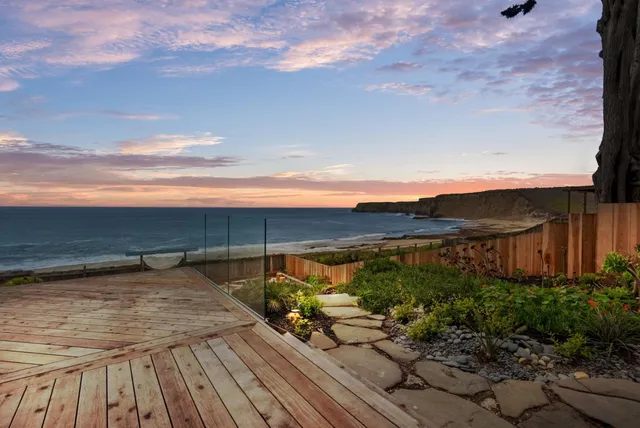 a room with lots of wooden furniture and a glass door