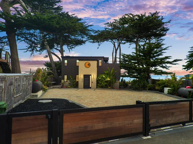 a view of a car parked in back of a building