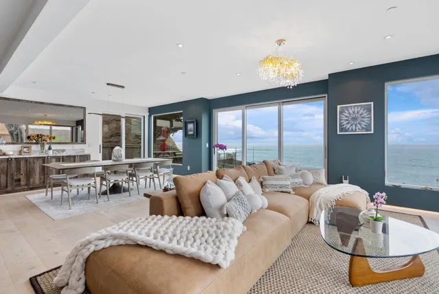 a living room with furniture and a table