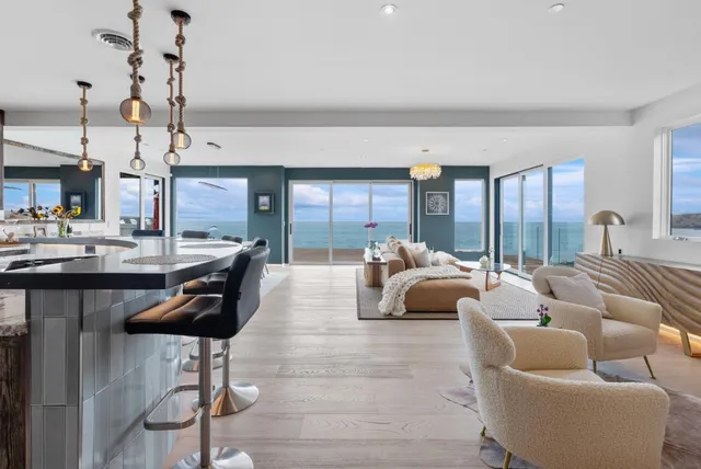 a bathroom with a double vanity sink mirror and bathtub