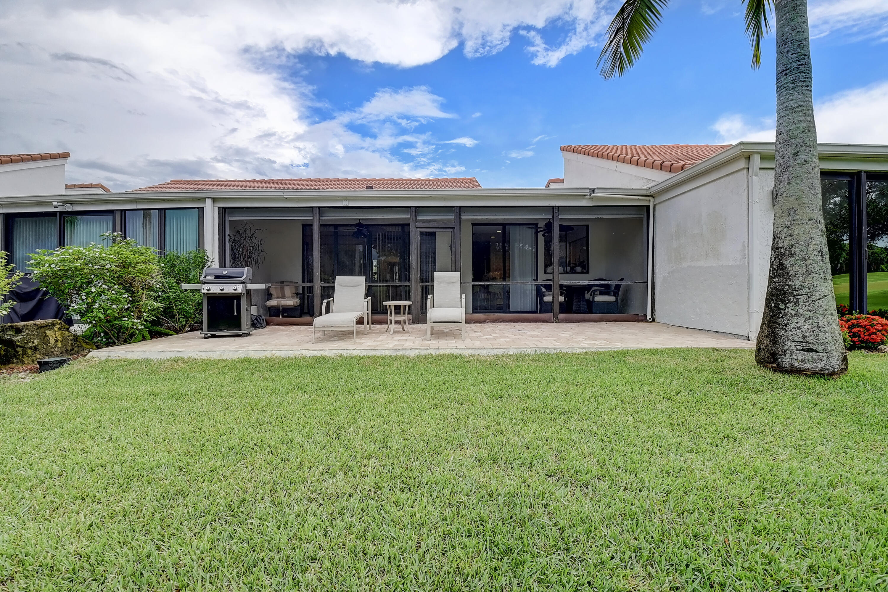 19550 Sawgrass Drive, Unit 2102 Boca Raton, FL 33434 - Photo 24 of 76 a view of a house with backyard porch and sitting area