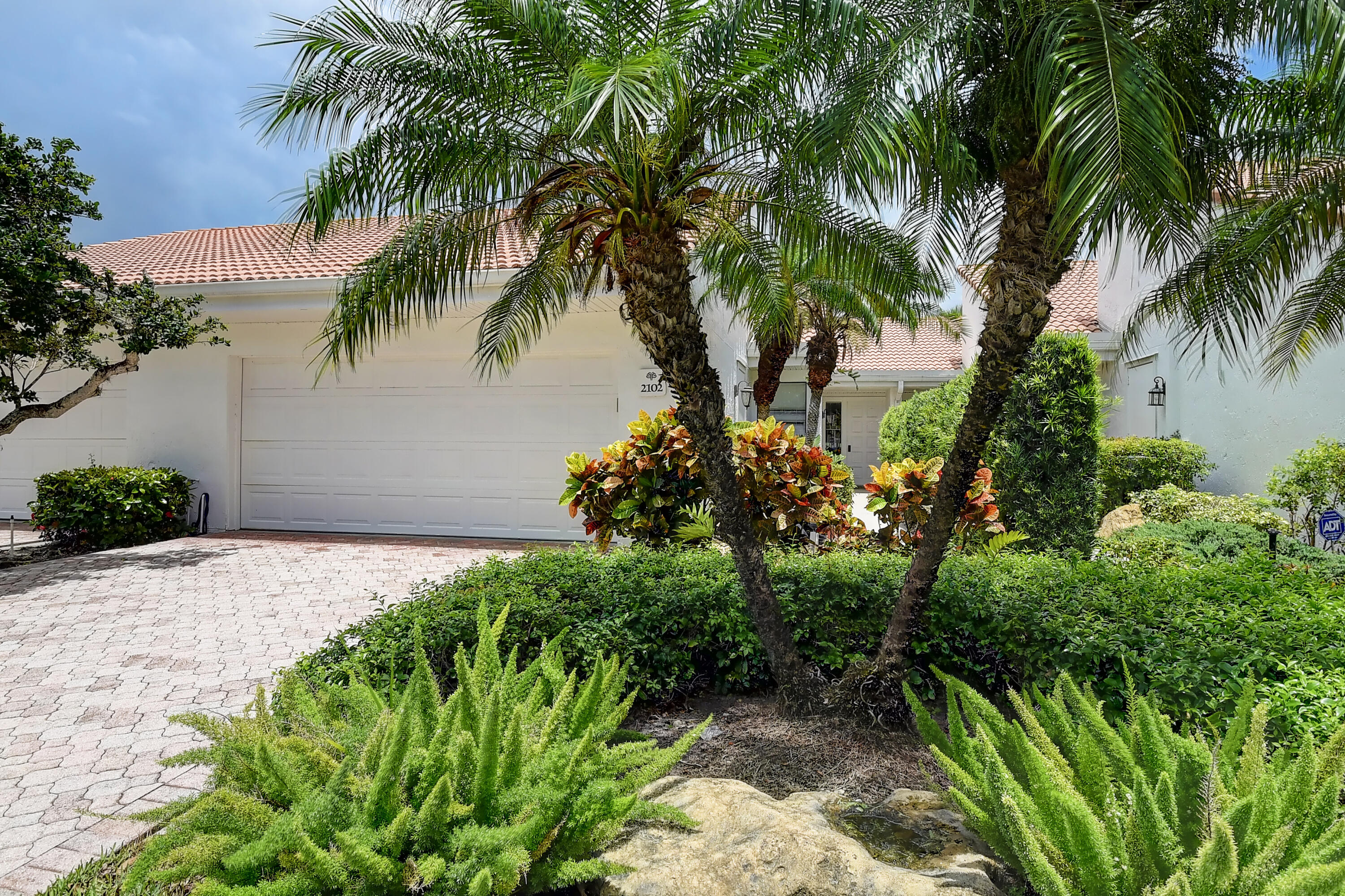 19550 Sawgrass Drive, Unit 2102 Boca Raton, FL 33434 - Photo 3 of 76 a plant that is in front of a house