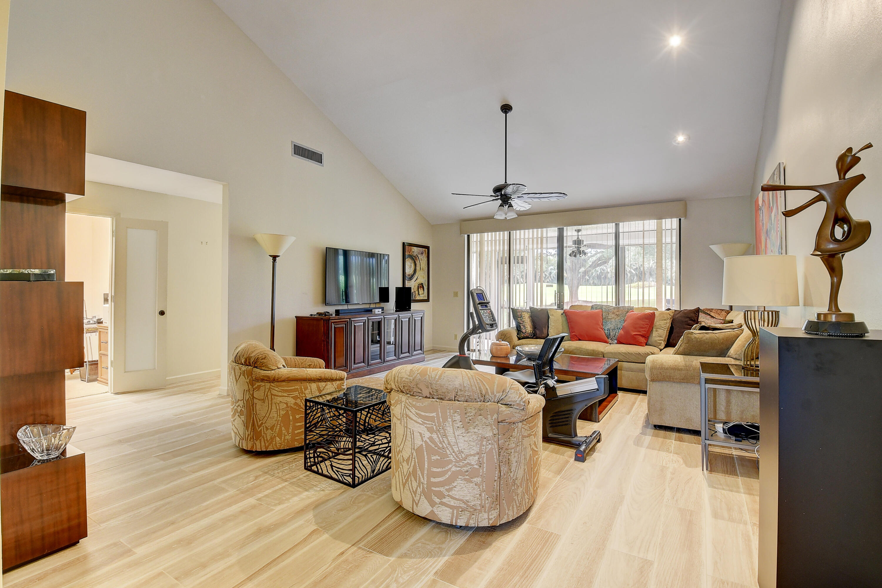 19550 Sawgrass Drive, Unit 2102 Boca Raton, FL 33434 - Photo 6 of 76 a living room with fireplace furniture and a wooden floor
