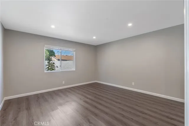 a view of room with wooden floor and window
