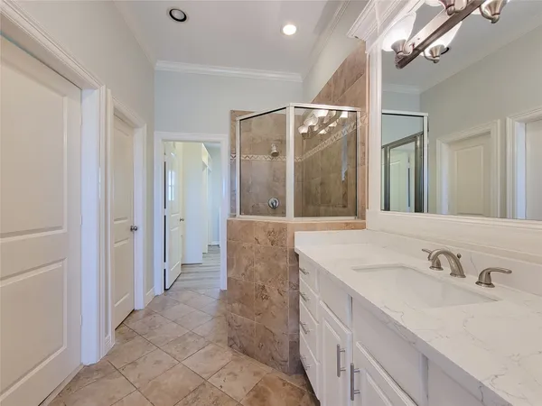 a bathroom with a double vanity sink mirror and