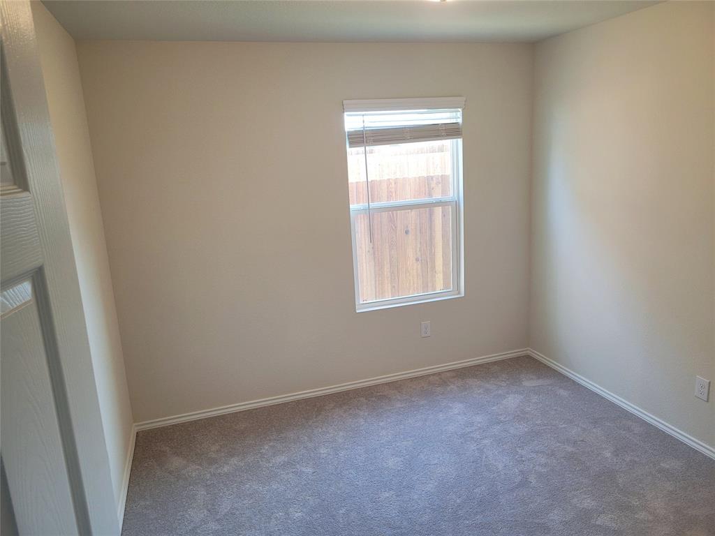 16029 Pemberly Lane Haslet, TX 76052 - Photo 11 of 19 an empty room with windows