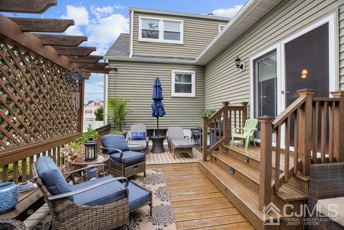 82 Brandywine Road Fords, NJ 08863 - Photo 23 of 26 a view of a deck with couches table and chairs