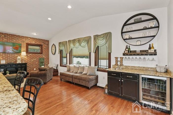 82 Brandywine Road Fords, NJ 08863 - Photo 6 of 26 a living room with furniture a large window and wooden floor