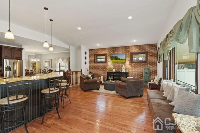 82 Brandywine Road Fords, NJ 08863 - Photo 10 of 26 a living room with furniture kitchen view and a wooden floor