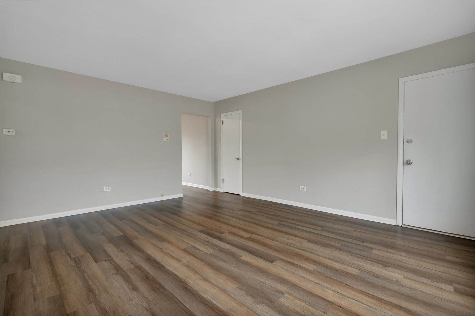 42 South Waiola Avenue, Unit 2 La Grange, IL 60525 - Photo 5 of 13 a view of an empty room with wooden floor