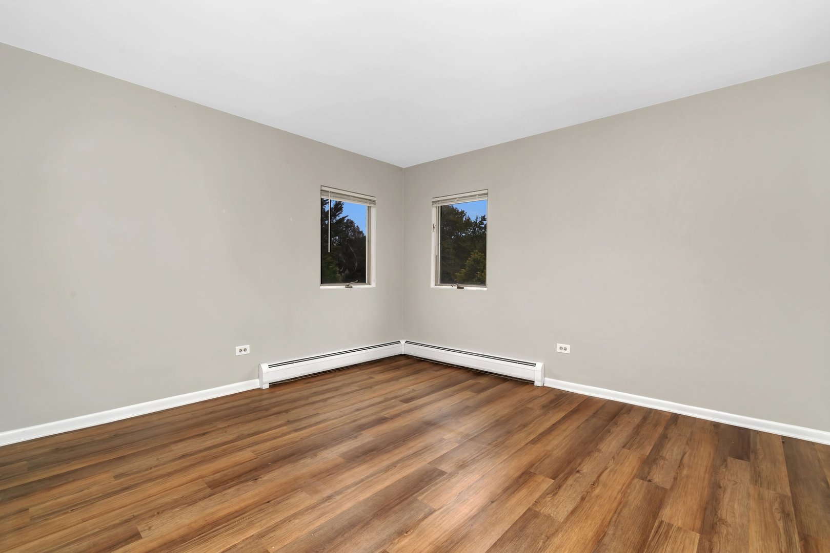 42 South Waiola Avenue, Unit 2 La Grange, IL 60525 - Photo 10 of 13 a view of an empty room with wooden floor and a window