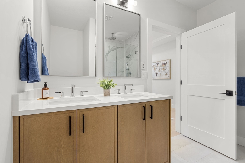 145 Warren Street, Unit 4 Newton, MA 02459 - Photo 12 of 35 a bathroom with a sink and a mirror
