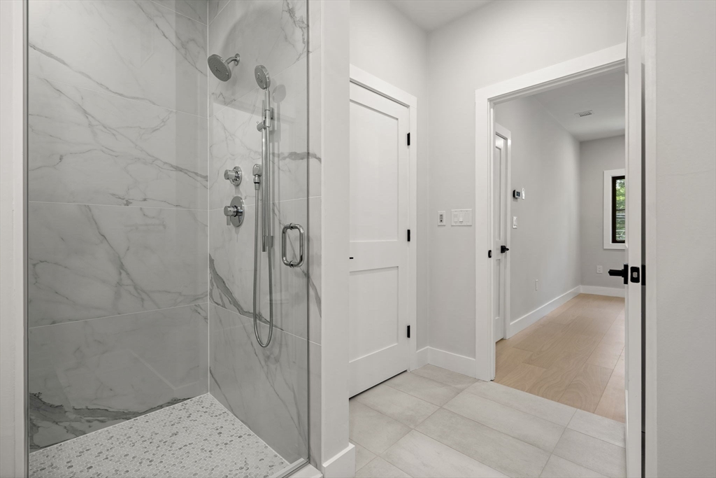 145 Warren Street, Unit 4 Newton, MA 02459 - Photo 23 of 35 a bathroom with a shower