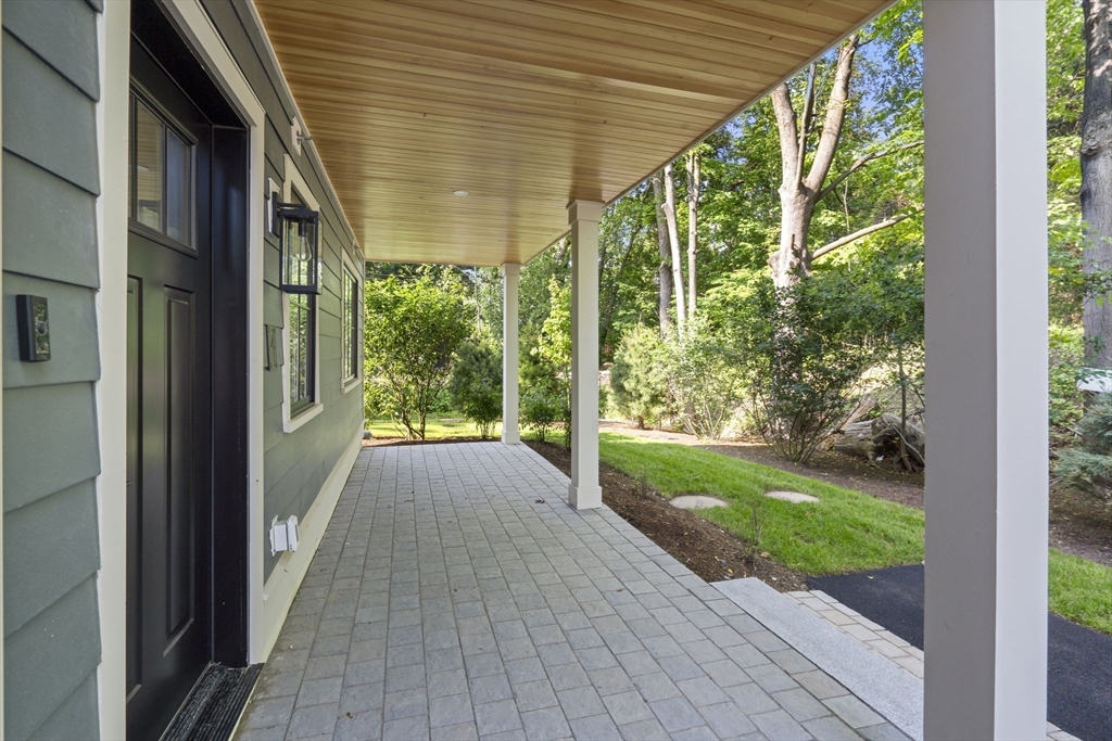 145 Warren Street, Unit 4 Newton, MA 02459 - Photo 25 of 35 a view of a porch with wooden floor and stairs