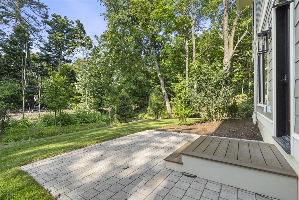145 Warren Street, Unit 4 Newton, MA 02459 - Photo 27 of 35 a view of backyard with green space
