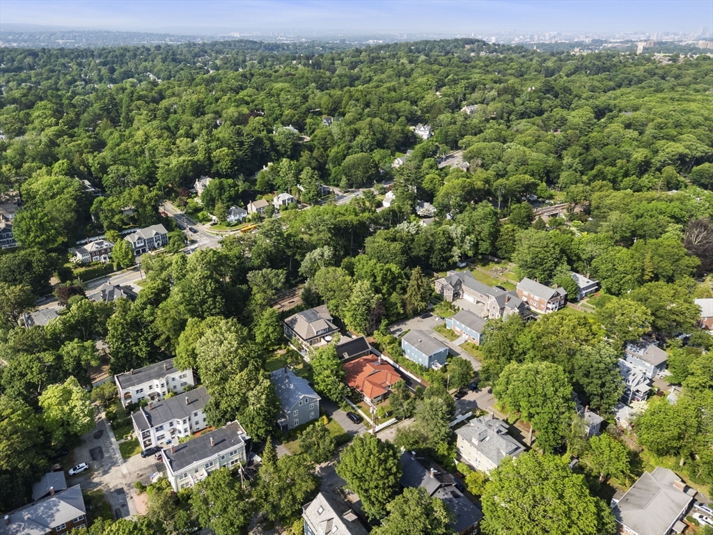 145 Warren Street, Unit 4 Newton, MA 02459 - Photo 29 of 35 an aerial view of residential houses with outdoor space and trees