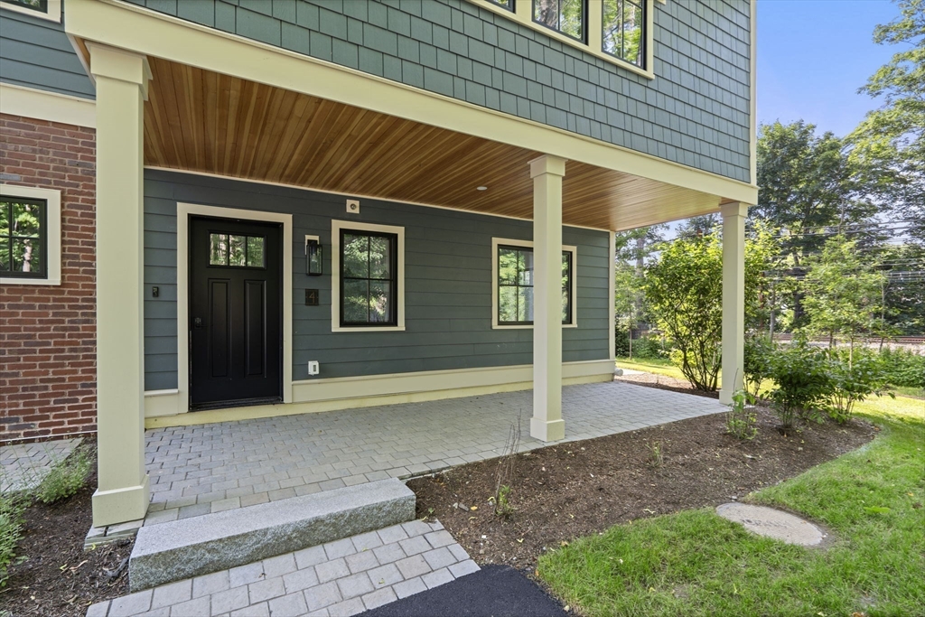145 Warren Street, Unit 4 Newton, MA 02459 - Photo 3 of 35 a view of a house with a yard