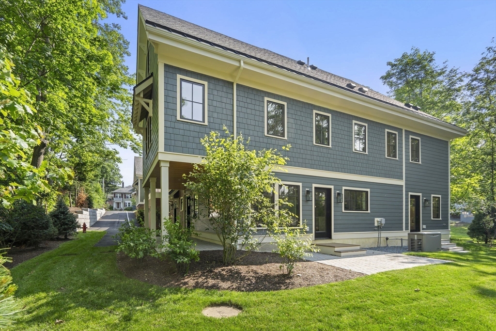 145 Warren Street, Unit 4 Newton, MA 02459 - Photo 31 of 35 front view of house with a yard