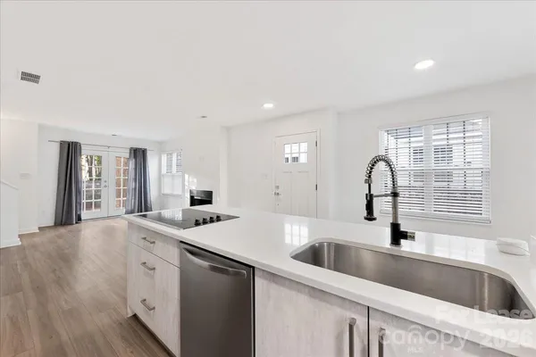 a kitchen with a sink and cabinets